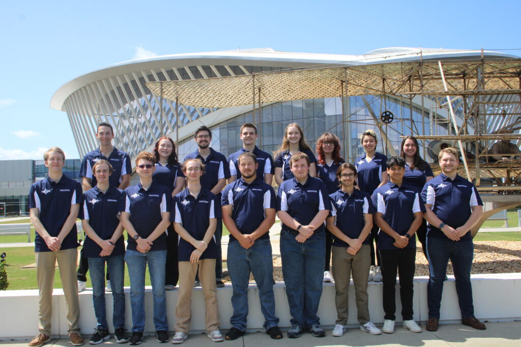 Group photo of AMRA team standing outside Embry-Riddle student union.
