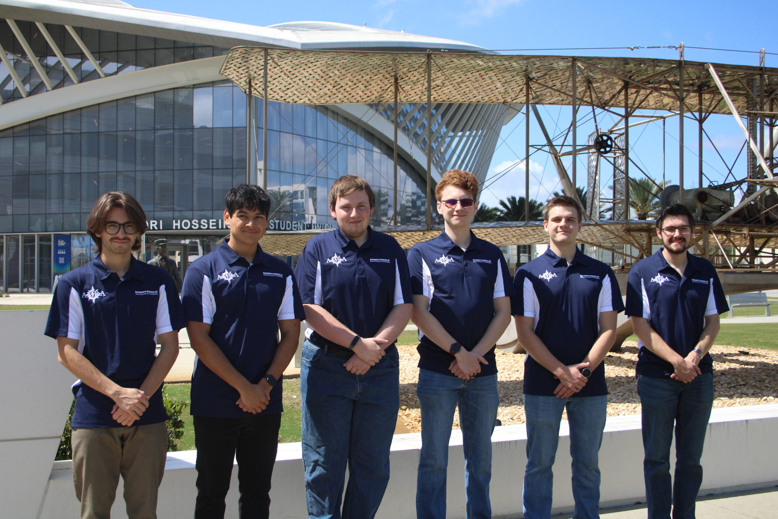 Group photo of Wave Co. standing in front of Embry-Riddle student union
